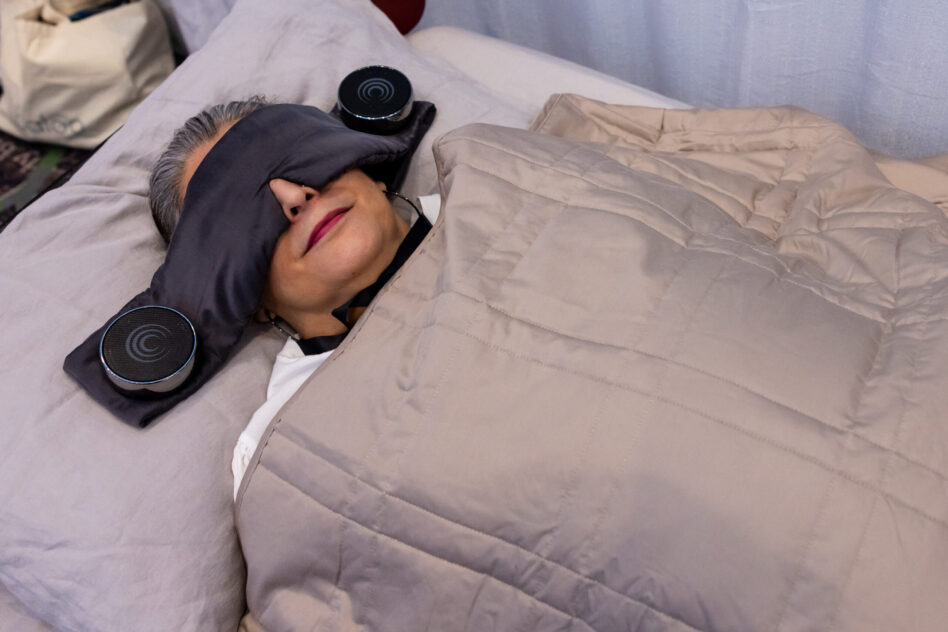 woman under a weighted blanket